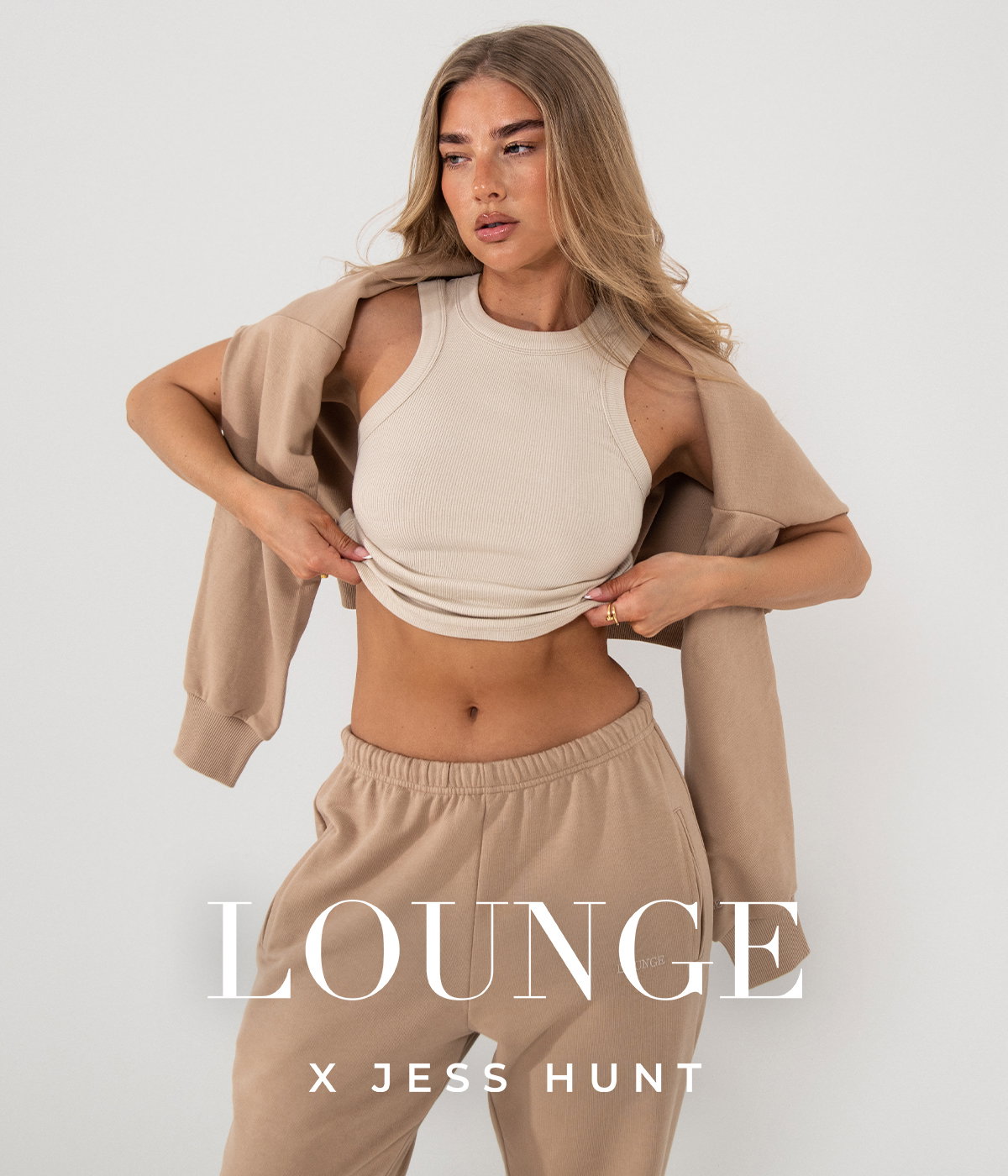 Lounge × Jess Hunt — Studio frame on warm grey with the LOUNGE X JESS HUNT lock-up