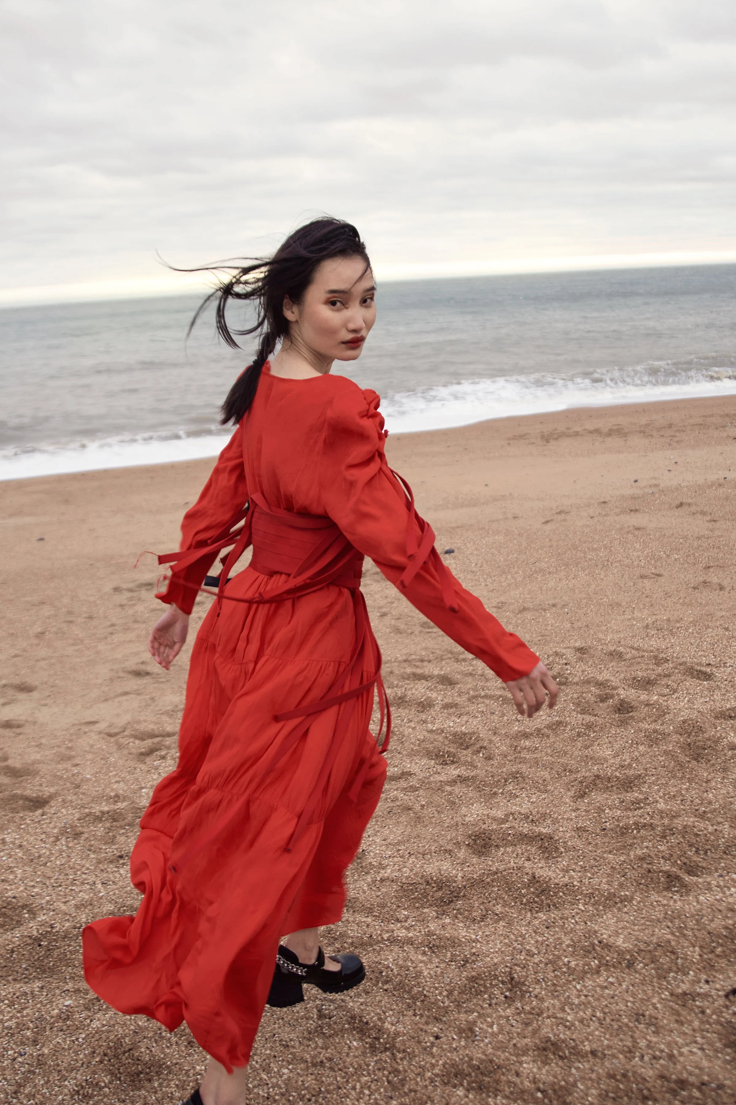 River Nile for Overdue Magazine — Red dress turning in warm light