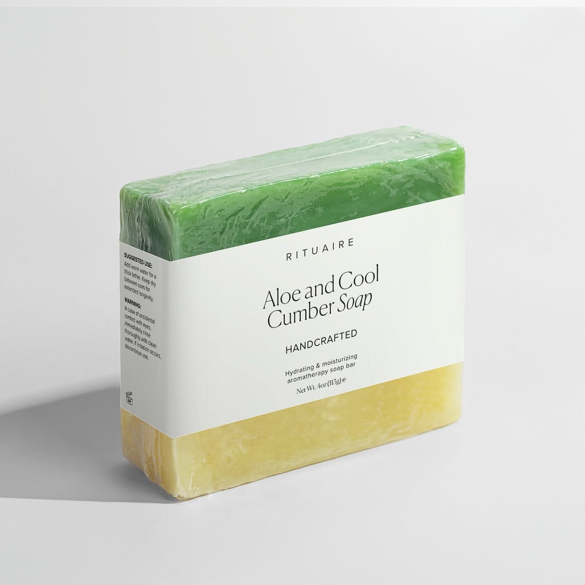 Rituaire Aloe & Cool Cumber soap — sleeved bar beside an unwrapped bar